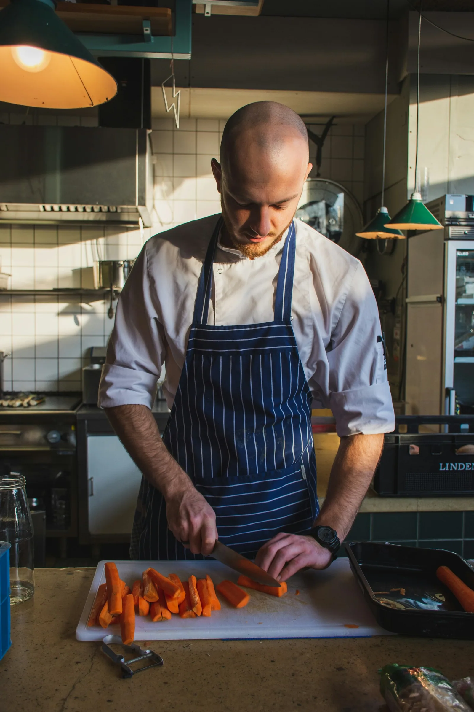 A chef at work in a professional kitchen.